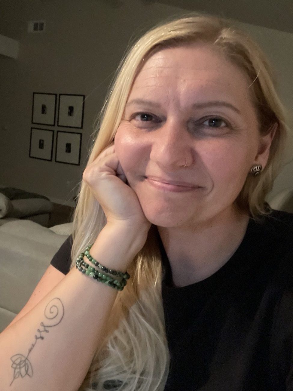 Stefanie Smith in a quieter moment, resting her chin on her hand